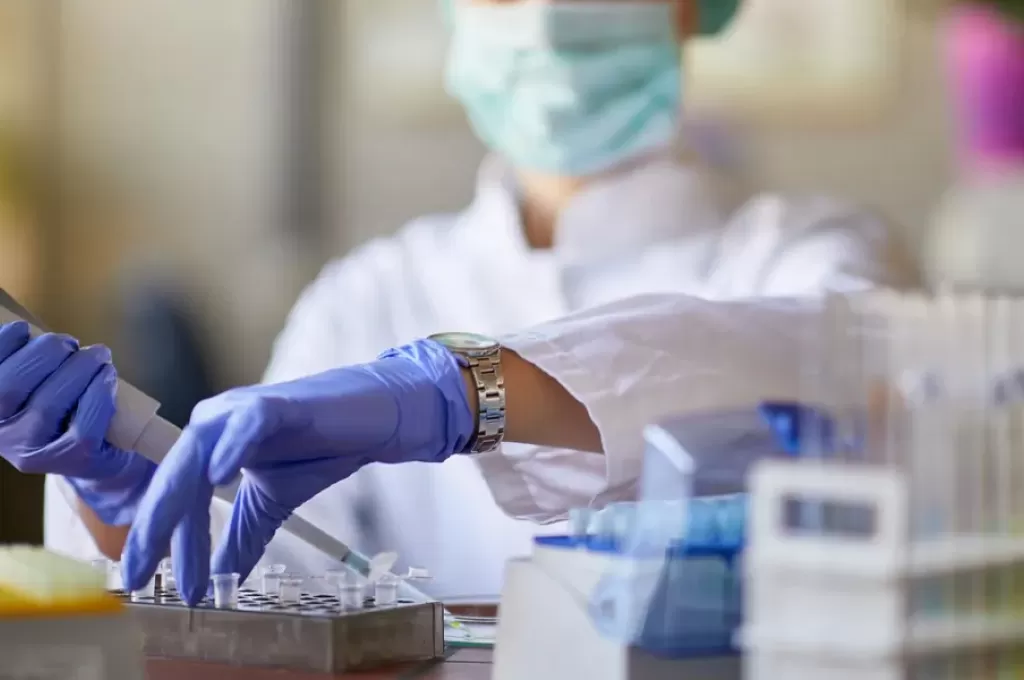 person in a laboratory testing a sample 9f86fd82